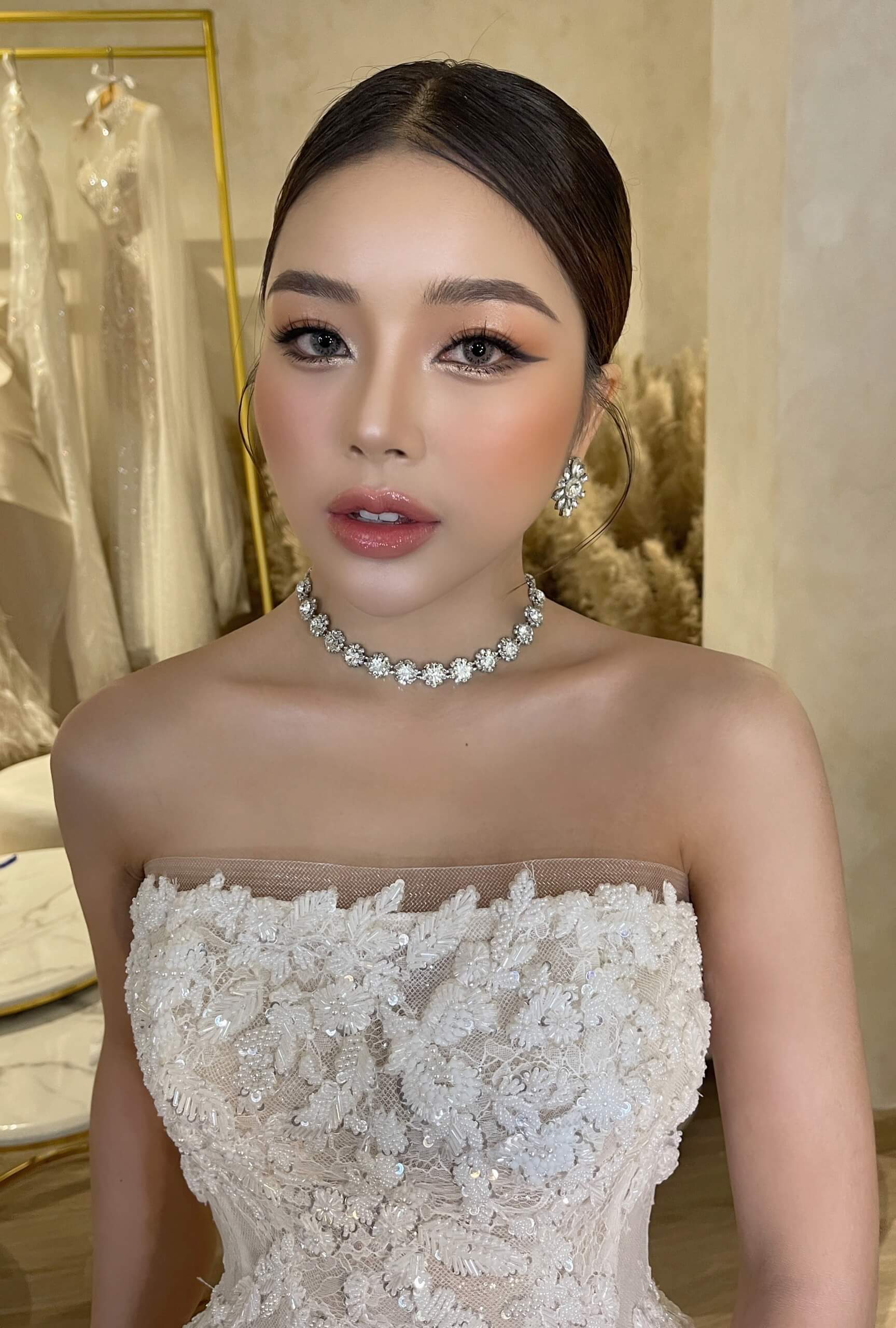 Sophisticated bridal look with crystal necklace