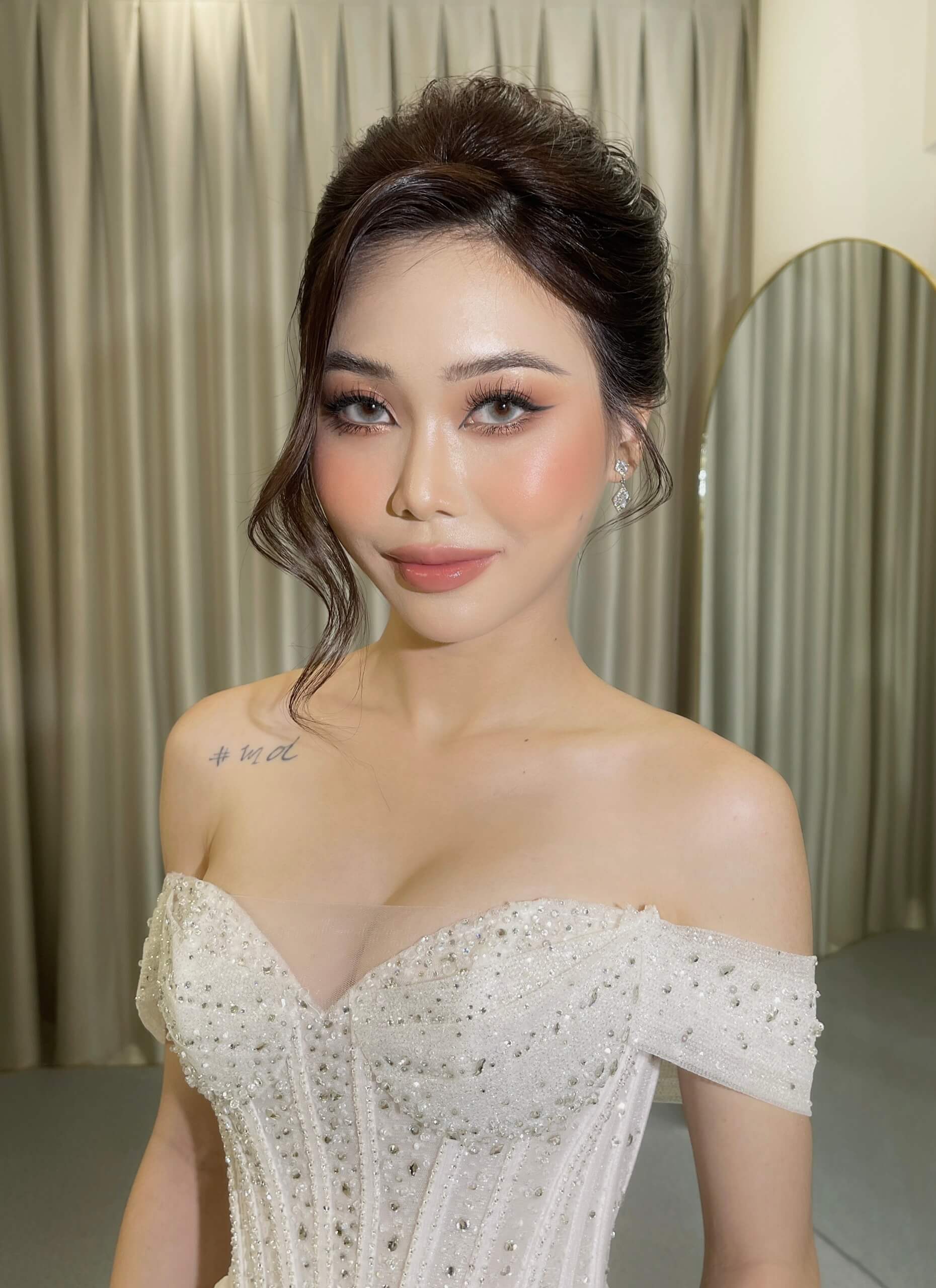 Natural bridal makeup with elegant updo